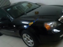 Cần bán Daewoo Magnus  2.5 2004 - Bán xe Daewoo Magnus 2.5 đời 2004 màu đen, giá chỉ 260 triệu