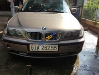 Cần bán BMW 325i AT 2003 - Chính chủ bán BMW 325i AT đời 2003, màu vàng