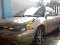 Cần bán Ford Contour 1996 - Bán ô tô Ford Contour sản xuất năm 1996, màu vàng giá cạnh tranh