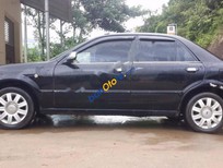 Ford Laser GHIA 1.8 MT 2004 - Cần bán lại xe Ford Laser GHIA 1.8 MT năm 2004, màu đen giá cạnh tranh