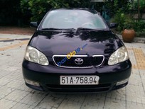 Cần bán Toyota Corolla altis 1.3 2002 - Cần bán Toyota Corolla altis năm sản xuất 2002, màu đen, xe rất tiết kiệm xăng