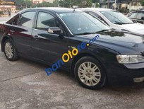 Ford Mondeo 2004 - Cần bán Ford Mondeo đời 2004, màu đen, xe cũ