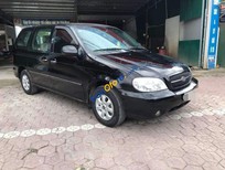 Cần bán Kia Carnival GS 2006 - Bán xe cũ Kia Carnival GS đời 2006, màu đen, nhập khẩu 