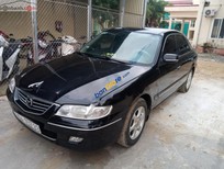 Mazda 626 2.0 MT 2003 - Cần bán gấp Mazda 626 2.0 MT sản xuất năm 2003, màu đen