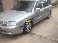 Cần bán xe Kia Spectra  MT 2003 - Cần bán lại xe Kia Spectra MT sản xuất năm 2003, màu bạc