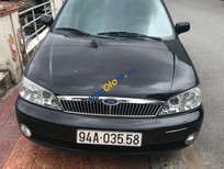 Cần bán Ford Laser   2002 - Bán Ford Laser sản xuất 2002, màu đen, nhập khẩu