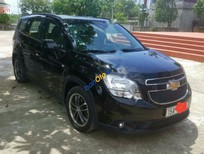 Cần bán Chevrolet Orlando   2012 - Cần bán Chevrolet Orlando sản xuất năm 2012, màu đen xe gia đình, giá chỉ 380 triệu