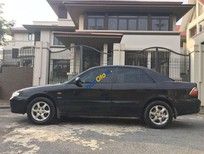 Cần bán xe Mazda 626   2004 - Gia đình bán xe Mazda 626 năm 2004, màu đen, xe nhập