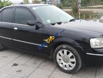 Ford Laser GHIA 1.8 AT 2004 - Bán Ford Laser 1.8 năm sản xuất 2004, màu đen, xe nhập như mới, giá tốt