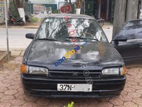 Cần bán Mazda 323 1995 - Xe Mazda 323 sản xuất năm 1995, màu xám, giá chỉ 35 triệu