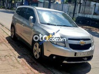 Bán xe oto Chevrolet Orlando 2012 - Bán ô tô Chevrolet Orlando năm sản xuất 2012, màu bạc  