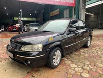 Bán Ford Laser   1.8 Ghia  2005 - Cần bán Ford Laser 1.8 Ghia 2005, màu đen