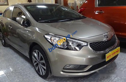 Kia K3 AT 2015 - Bán Kia K3 AT sản xuất 2015, màu nâu số tự động, giá 580tr