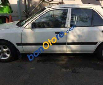 Mazda 323 MT 1995 - Bán xe Mazda 323 MT sản xuất 1995, màu trắng số sàn 