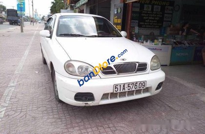 Daewoo Lanos    MT 2002 - Cần bán Daewoo Lanos MT năm 2002, màu trắng đã đi 180000 km