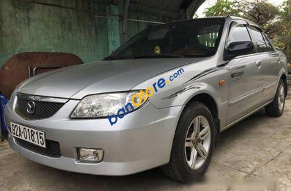 Mazda 323  MT 2004 - Cần bán Mazda 323 MT đời 2004, màu bạc