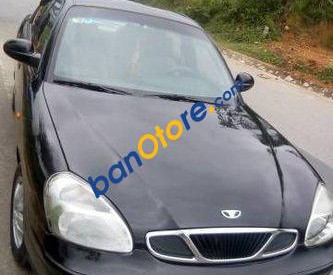 Daewoo Nubira  MT 2004 - Bán xe Daewoo Nubira MT sản xuất năm 2004, màu đen, giá tốt