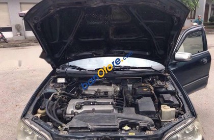 Ford Laser 1.6 2002 - Cần bán xe Ford Laser 1.6 sản xuất năm 2002, màu đen