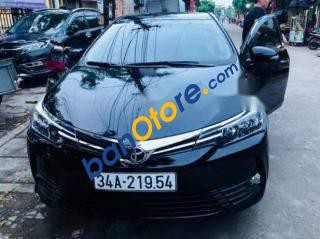 Toyota Corolla altis   1.8E AT 2017 - Cần bán lại xe Toyota Corolla Altis 1.8E AT năm 2017, màu đen số tự động, giá 720tr