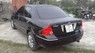 Ford Laser Ghia 1.8 2003 - Xe Ford Laser GHIA 1.8 đời 2003, màu đen số tự động cần bán 