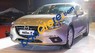 Mazda 323 2016 - Cần bán xe Mazda 323 năm sản xuất 2016, màu vàng, 705tr