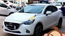 Mazda 2 2015 - Cần bán gấp Mazda 2 đời 2015, màu trắng, xe mới đẹp như trong hình, còn bảo hành đầy đủ