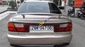 Mazda 323 2000 - Cần bán lại xe Mazda 323 sản xuất 2000, màu vàng số sàn