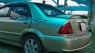 Ford Laser GHIA 1.8 2002 - Cần bán Ford Laser GHIA 1.8 sản xuất 2002, màu vàng