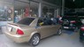 Ford Laser Ghia 1.8MT 2002 - Bán ô tô Ford Laser Ghia 1.8MT năm sản xuất 2002, màu vàng, 205 triệu