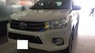 Toyota Hilux 2.4E 2016 - Bán ô tô Toyota Hilux 2.4E năm 2016, màu trắng, xe nhập 