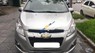 Chevrolet Spark LT 2014 - Cần bán gấp Chevrolet Spark LT năm 2014, màu bạc số sàn 