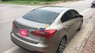 Kia K3 MT 2014 - Bán xe Kia K3 MT đời 2014, màu vàng, động cơ 1.6 số sàn, còn rất mới