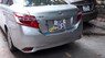 Toyota Vios 1.5E 2014 - Cần bán Toyota Vios 1.5E sản xuất năm 2014, màu bạc xe gia đình