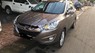 Hyundai Tucson 2.0 AT 4WD 2010 - Bán ô tô Hyundai Tucson 2.0 AT 4WD năm sản xuất 2010, màu xám 