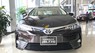 Toyota Corolla altis 1.8E (CVT) 2018 - Cần bán Toyota Corolla altis 1.8E (CVT) sản xuất năm 2018, màu nâu, 707 triệu