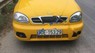 Daewoo Lanos SX 2002 - Cần bán lại xe Daewoo Lanos SX 2002, màu vàng 