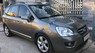 Kia Carens 2.0 AT 2009 - Em cần bán xe Kia Carens 2009 2.0, tự động, màu nâu xám bản full option