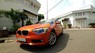 BMW 1 Series  116i  2014 - Chính chủ bán BMW 1 Series 116i đời 2014, màu cam