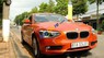 BMW 1 Series  116i  2014 - Chính chủ bán BMW 1 Series 116i đời 2014, màu cam