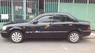 Ford Laser Ghia 1.8  2004 - Bán Ford Laser Ghia 1.8 năm 2004, màu đen số sàn