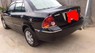 Ford Laser Ghia 1.8 AT 2005 - Cần bán gấp Ford Laser Ghia 1.8 AT đời 2005, màu đen chính chủ