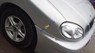 Daewoo Lanos SX 2005 - Cần bán gấp Daewoo Lanos SX năm 2005, màu bạc