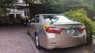 Toyota Camry  2.0 E   2014 - Cần bán lại xe Toyota Camry 2.0 E sản xuất 2014, màu vàng, xe nhập như mới