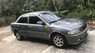 Mazda 323 1999 - Cần bán Mazda 323 năm sản xuất 1999, màu xám, 90 triệu