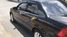 Ford Laser   2002 - Bán Ford Laser năm sản xuất 2002, màu đen, nhập khẩu, giá tốt