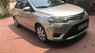 Toyota Vios 2014 - Cần bán Toyota Vios năm 2014, màu vàng, giá 318tr